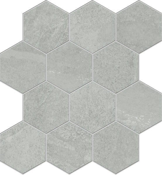 The Shyft Hexagon Mosaic Porcelain Tile features a light gray honeycomb pattern, with each tile showcasing subtle texture and shading variations for a modern look.