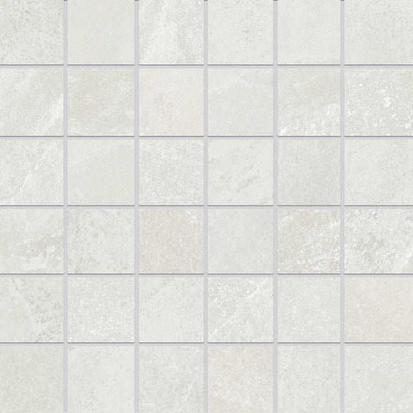 A close-up view of Shyft 2x2 Mosaic Porcelain Tile shows light gray squares with subtle texture and shading inspired by Brazilian slate, arranged in a grid and separated by thin grout lines.