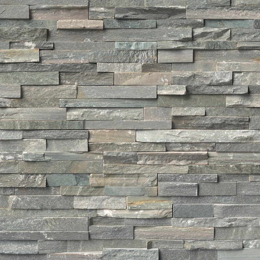 The Landscape 6x24 Natural Stone Ledger Panel features uneven, rectangular gray tiles of varying lengths and thicknesses. Subtle color variations from light to dark gray create a textured, layered look for a striking wall design.