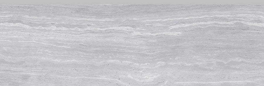 A close-up of the Silk 10x22 Glossy Porcelain Tile reveals a silky smooth surface, evoking the luxurious feel of high-end flooring.