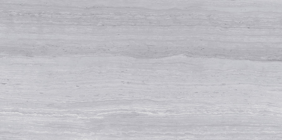 Silk 12x24 Matte Porcelain Tile features a smooth, natural stone texture with subtle horizontal striations and layered patterns in varying shades of gray, offering a calm and elegant look for any space.