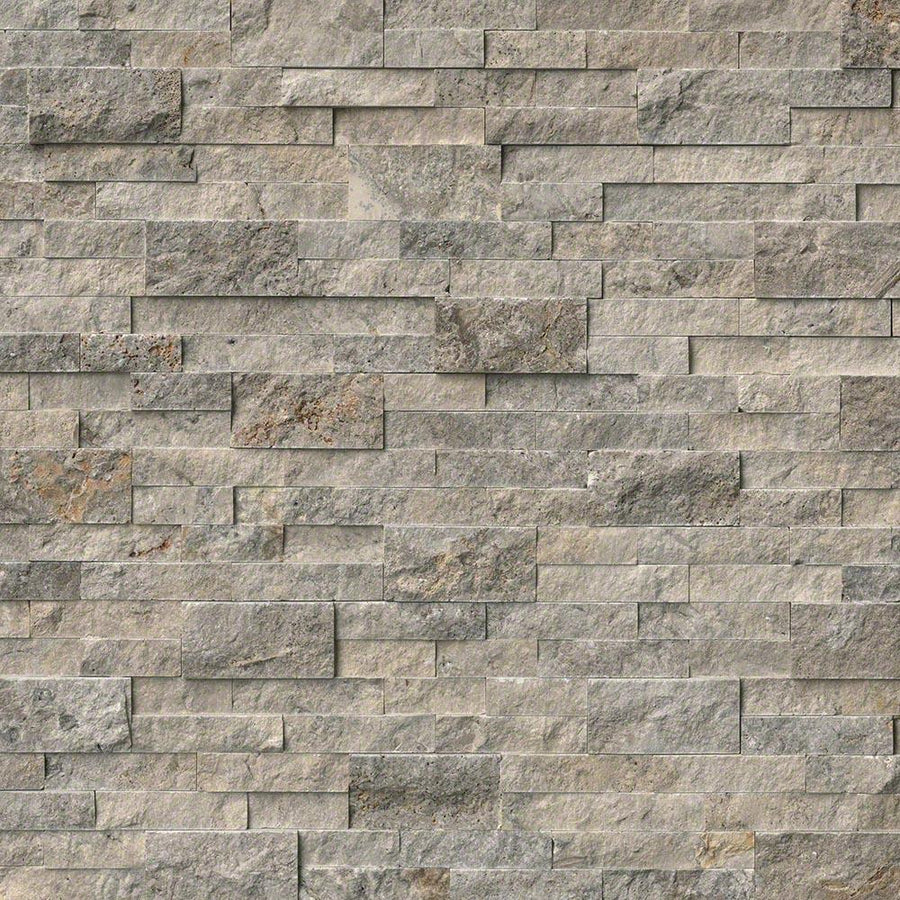 A close-up of a wall featuring Landscape 6x24 Natural Stone Ledger Panel tiles in a staggered, brick-like layout, highlighting the panel's varied shades and textures for a striking wall design.