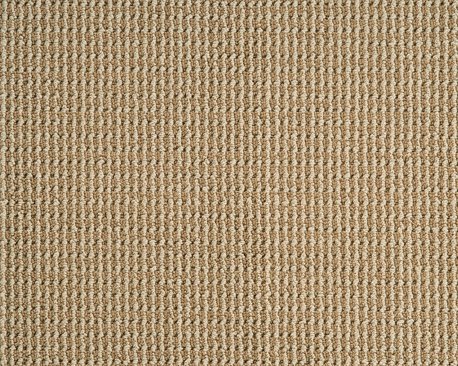 Close-up of the Bandala Jazzed Berber Carpet in beige, featuring a tightly woven grid pattern. Made from durable Envision 66 fiber, this sisal-like carpet is soft yet resilient—ideal for light commercial spaces.