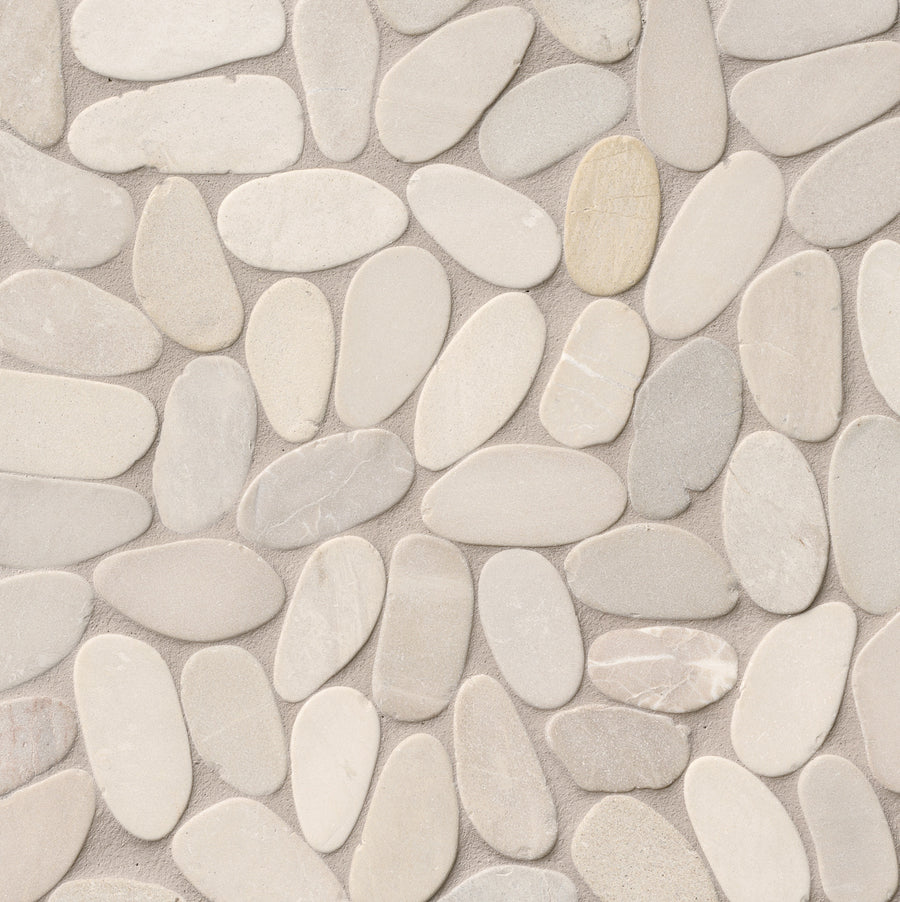 A close-up of the Sliced Pebble 12x12 Natural Stone shows smooth, oval, light beige and cream stones arranged tightly together, ideal for use as a marble pebble backsplash tile.
