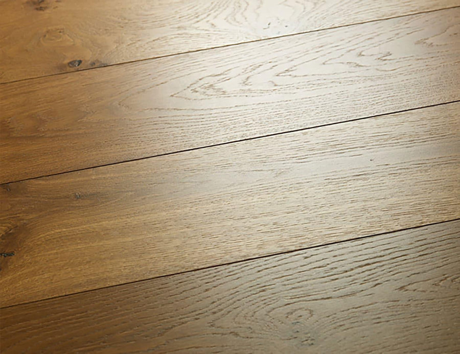Close-up of Westport 7 1/2" Hardwood, crafted from European White Oak. Planks are shown side by side, featuring natural wood grain, smooth surfaces, and subtle textures that highlight the floor’s organic patterns.