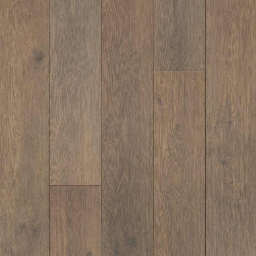 A close-up of Hill Valley 7.5" Waterproof Laminate shows oak-inspired wood grain patterns and subtle knots. The textured planks, arranged parallel, highlight rich brown tones and natural color variations.