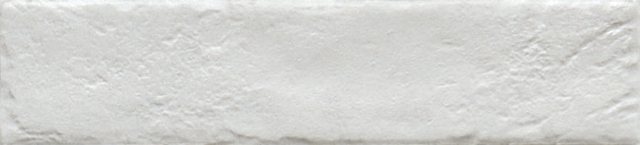 The Empire 2x10 Brick Porcelain Tile features a rectangular white design with a textured, slightly rough surface and uneven edges, capturing the rustic look of weathered stone or handmade ceramic.