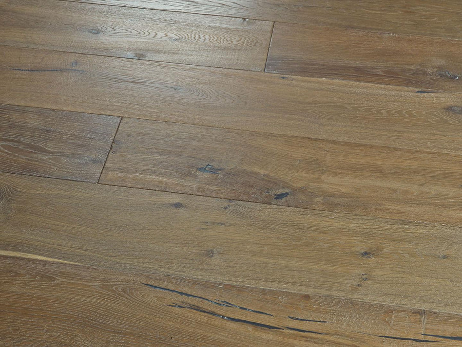 Close-up of Baldwin Hills 6" Hardwood flooring highlights its natural brown finish, visible wood grain, knots, and unique streaks that showcase the character of this stunning hardwood species.