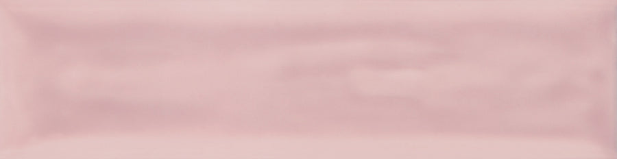 The Watercolor 3x12 Subway Tile is a rectangular, glossy tile in soft pastel pink with subtle shading and a smooth, slightly uneven texture—ideal for modern designs or adding fresh color to your space.