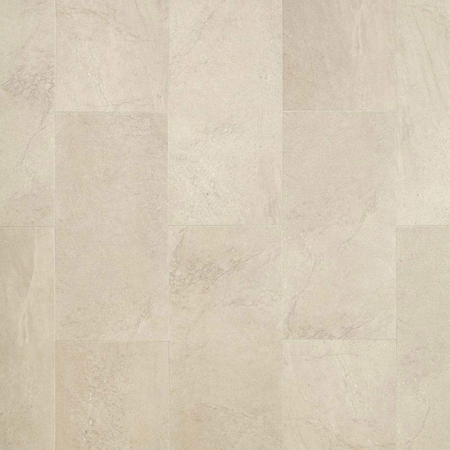 A close-up of Meridian Adura® Rigid 12x24 Vinyl Tile shows beige tones with subtle natural patterns and shade variations. The smooth, matte surface and staggered grid layout create a contemporary flooring look, perfect for modern interiors.