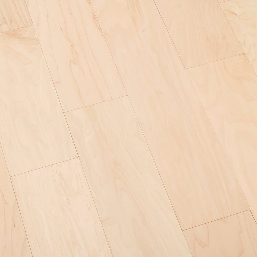 Farmhouse Chic 6 1/2" Handscraped Maple Hardwood features light-colored planks with natural grain and subtle tone variations, arranged in a staggered pattern for authentic Farmhouse Chic style.