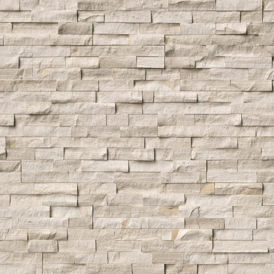 The Landscape 6x24 Natural Stone Ledger Panel features beige split-face stones in rectangular, uneven sizes and shades, creating a textured, rustic wall with a natural, layered look.