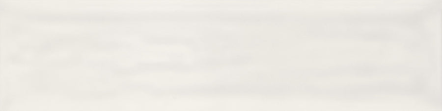 The Watercolor 3x12 Subway Tile is a rectangular, glossy off-white tile with a smooth, subtle wavy texture and slightly beveled edges—ideal for modern spaces and those wanting a fresh color palette.