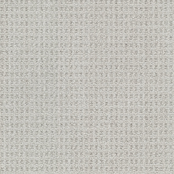 Close-up of the Winslow Berber Carpet in light gray, featuring a subtle grid pattern with fine, even threads and natural woven textures for a soft, neutral look.