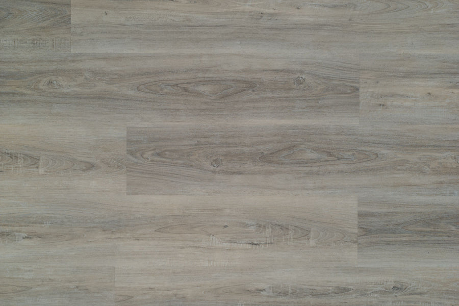 Hydro Vinyl II 7" Vinyl Plank features a light brown wood look with natural grain, knots, and subtle color variations. The matte-finish planks are arranged horizontally and offer waterproof SPC flooring durability.