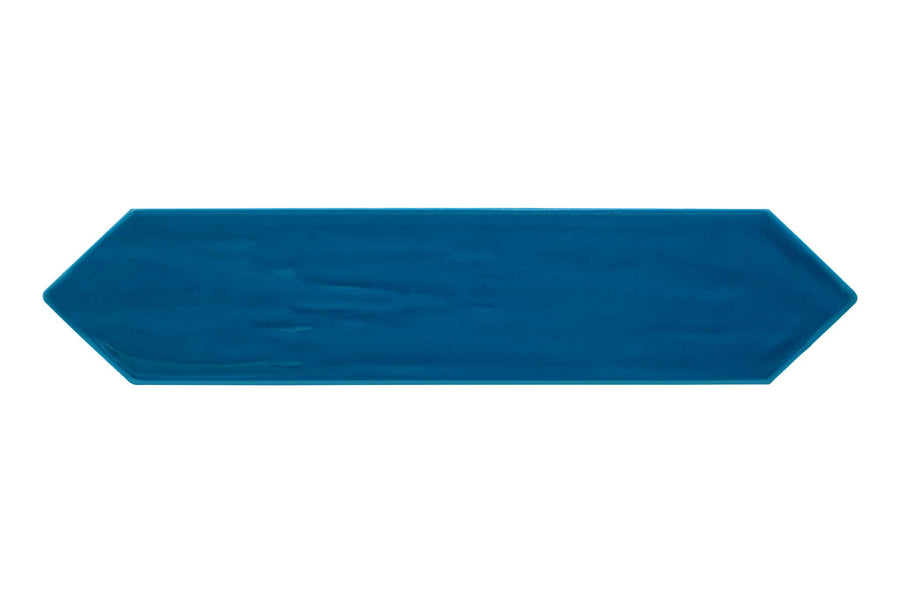 The Watercolor 3x12 Picket Glazed Ceramic Tile features a long, narrow blue shape with pointed ends, bringing a fresh color palette and modern design to any space against a white background.