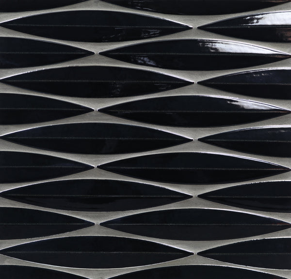 A close-up of Ka-Nu Keel 3D Mosaic Tile, showing elongated glossy black diamond-shaped ceramic tiles arranged in horizontal rows with thin metallic silver borders.