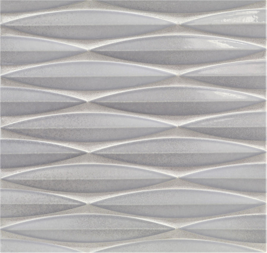 The Ka-Nu Keel 3D Mosaic Tile features a textured ceramic surface with a repeating geometric pattern of elongated diamonds in gray and white glazes, offering a modern, three-dimensional look.