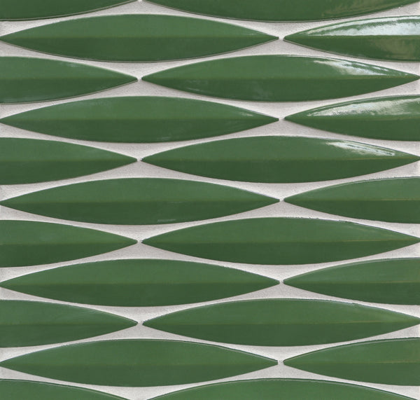 The Ka-Nu Keel 3D Mosaic Tile features glossy, green, leaf-shaped ceramic pieces in a repeating geometric pattern, highlighted by brilliant glaze colors and white grout.