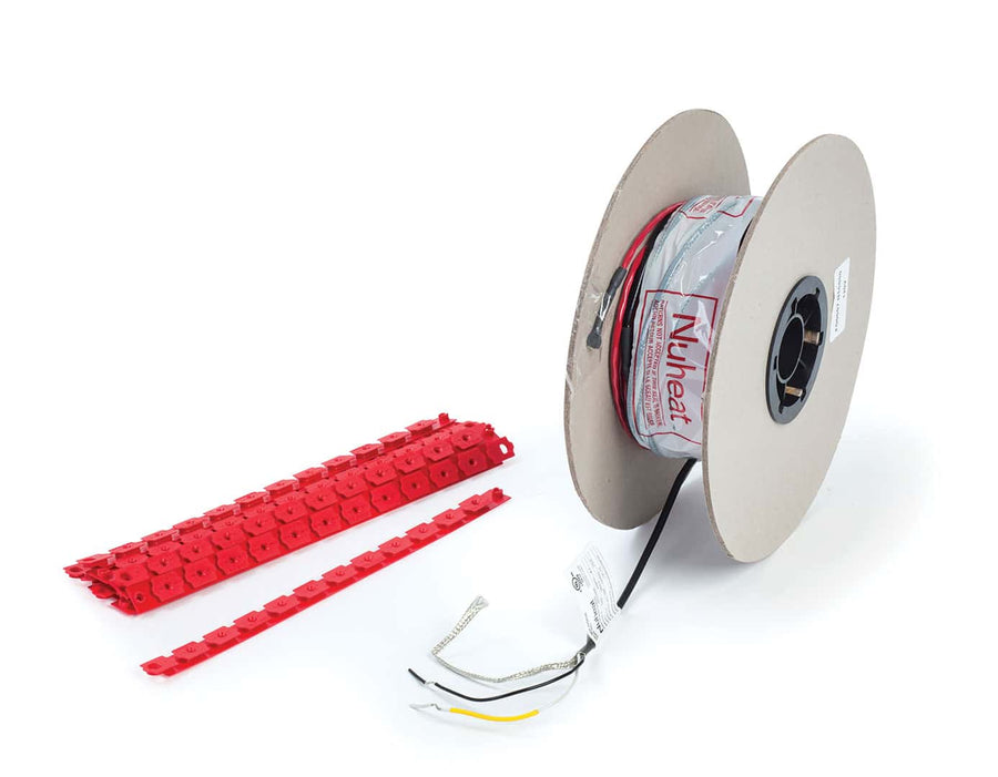 A spool of nVent Cable with exposed wires and flexible wire spacing is shown beside two red plastic cable guides on a white background.