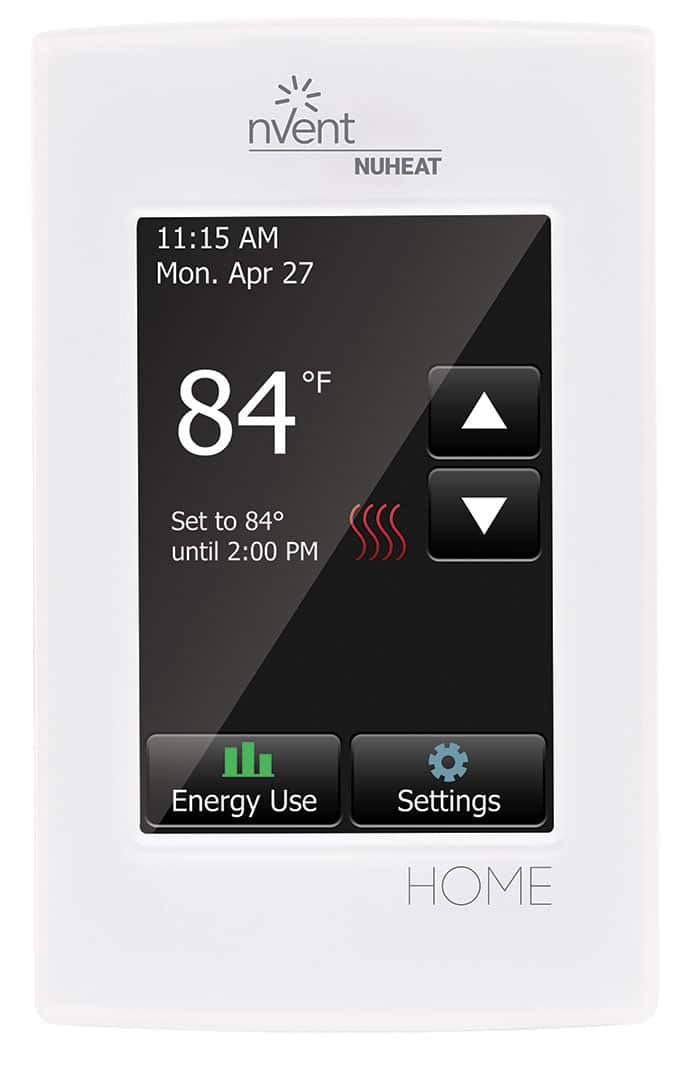 The white nVent Nuheat Home touchscreen thermostat displays 84°F and shows date, time, and target temperature, providing easy control of electric floor heating, energy use, and settings for efficient comfort management.