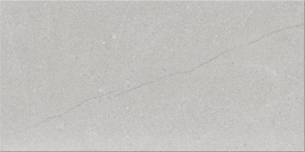 The Sandwaves 24x48 Porcelain Tile features a light gray tone with a subtle diagonal crack, minimal texture, and fine speckles—an ideal choice for contemporary decor.