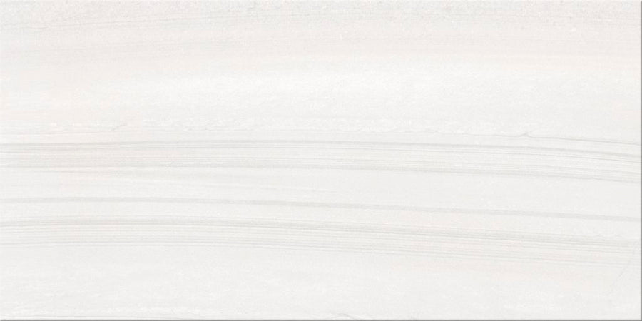 Sandwaves 12x24 Porcelain Tile features a pale, light-colored surface with subtle horizontal lines and gentle wavy patterns reminiscent of sandstone. Its delicate texture and shading variations are ideal for contemporary design.