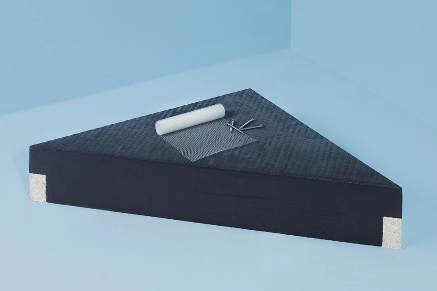 A black triangle displays a roll of white material shaped like the Wedi Corner Seat, which resembles prefabricated corner shower seats.